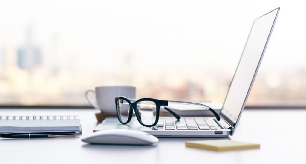 laptop with glasses on it